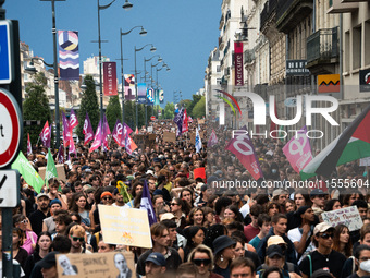 People march holding a banner that reads, 'A single solution destitution', during a protest after the appointment of a right-wing prime mini...