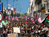 People march holding a banner that reads, 'A single solution destitution', during a protest after the appointment of a right-wing prime mini...