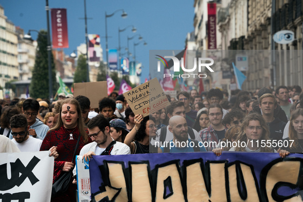 People march holding a banner that reads, 'A single solution destitution', during a protest after the appointment of a right-wing prime mini...