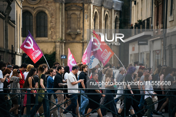 People march holding a banner that reads, 'A single solution destitution', during a protest after the appointment of a right-wing prime mini...