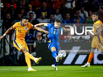 Netherlands forward Cody Gakpo and Bosnia and Herzegovina defender Jusuf Gazibegovic during the match between the Netherlands and Bosnia and...