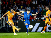 Netherlands forward Cody Gakpo and Bosnia and Herzegovina defender Jusuf Gazibegovic during the match between the Netherlands and Bosnia and...