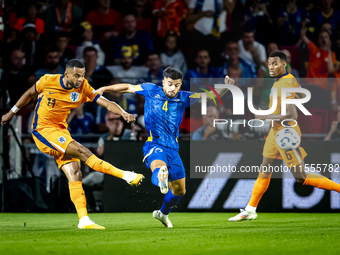 Netherlands forward Cody Gakpo and Bosnia and Herzegovina defender Jusuf Gazibegovic during the match between the Netherlands and Bosnia and...