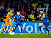 Netherlands forward Cody Gakpo and Bosnia and Herzegovina defender Jusuf Gazibegovic during the match between the Netherlands and Bosnia and...