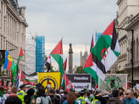 Pro-Palestinian activists and supporters wave Palestinian flags and hold placards as they march through London, United Kingdom, on September...