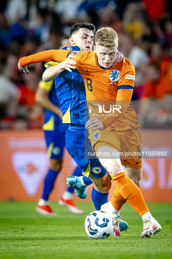 Bosnia and Herzegovina midfielder Benjamin Tahirovic and Netherlands midfielder Jerdy Schouten during the match between the Netherlands and...