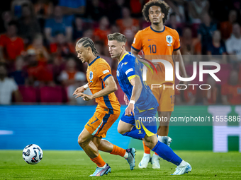 Netherlands midfielder Xavi Simons and Bosnia and Herzegovina forward Ermedin Demirovic during the match between the Netherlands and Bosnia...