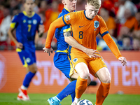 Bosnia and Herzegovina midfielder Benjamin Tahirovic and Netherlands midfielder Jerdy Schouten during the match between the Netherlands and...