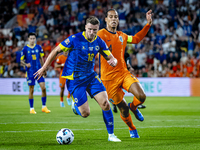 Bosnia and Herzegovina forward Ermedin Demirovic and Netherlands defender Virgil van Dijk during the match between the Netherlands and Bosni...