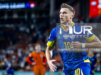 Bosnia and Herzegovina forward Ermedin Demirovic scores the 1-1 and celebrates the goal during the match between the Netherlands and Bosnia...