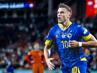 Bosnia and Herzegovina forward Ermedin Demirovic scores the 1-1 and celebrates the goal during the match between the Netherlands and Bosnia...