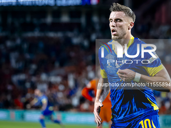 Bosnia and Herzegovina forward Ermedin Demirovic scores the 1-1 and celebrates the goal during the match between the Netherlands and Bosnia...