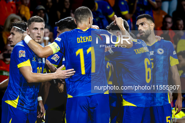 Bosnia and Herzegovina forward Ermedin Demirovic scores the 1-1 and celebrates the goal during the match between the Netherlands and Bosnia...