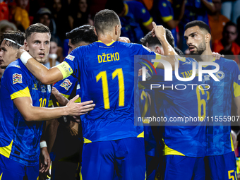 Bosnia and Herzegovina forward Ermedin Demirovic scores the 1-1 and celebrates the goal during the match between the Netherlands and Bosnia...