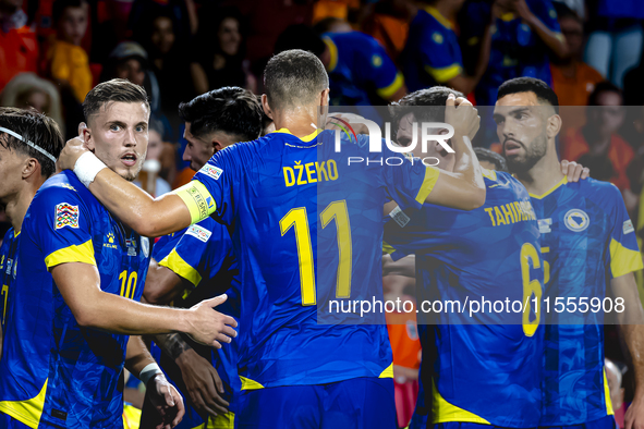 Bosnia and Herzegovina forward Ermedin Demirovic scores the 1-1 and celebrates the goal during the match between the Netherlands and Bosnia...