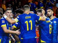 Bosnia and Herzegovina forward Ermedin Demirovic scores the 1-1 and celebrates the goal during the match between the Netherlands and Bosnia...