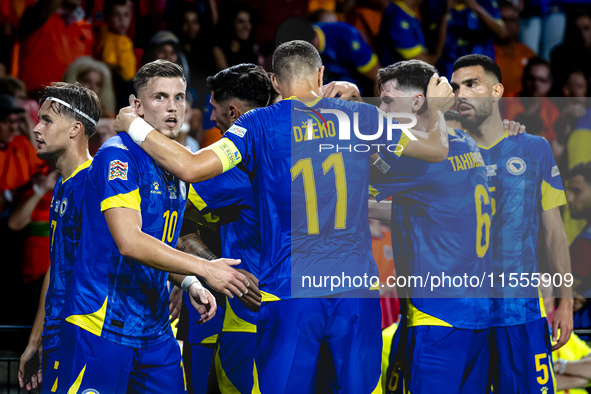 Bosnia and Herzegovina forward Ermedin Demirovic scores the 1-1 and celebrates the goal during the match between the Netherlands and Bosnia...