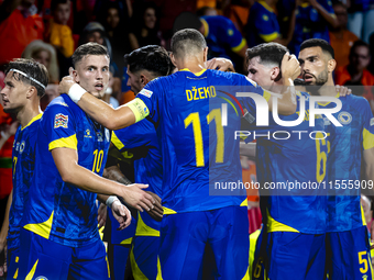 Bosnia and Herzegovina forward Ermedin Demirovic scores the 1-1 and celebrates the goal during the match between the Netherlands and Bosnia...