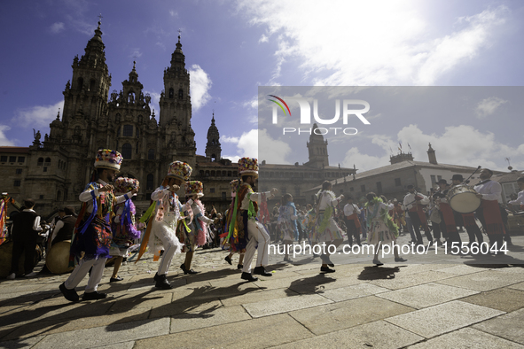 The annual parade of traditional costumes for the entroido, as the carnival is known in Galicia, takes place through the streets of Santiago...