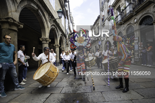 The annual parade of traditional costumes for the entroido, as the carnival is known in Galicia, takes place through the streets of Santiago...