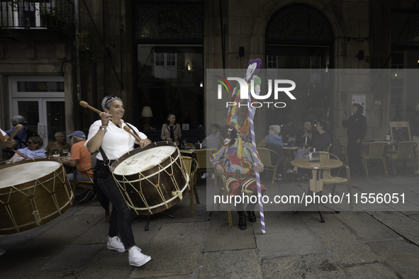 The annual parade of traditional costumes for the entroido, as the carnival is known in Galicia, takes place through the streets of Santiago...