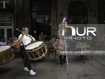 The annual parade of traditional costumes for the entroido, as the carnival is known in Galicia, takes place through the streets of Santiago...