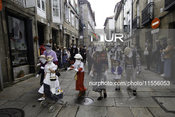 The annual parade of traditional costumes for the entroido, as the carnival is known in Galicia, takes place through the streets of Santiago...