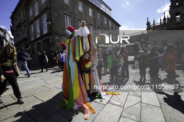 The annual parade of traditional costumes for the entroido, as the carnival is known in Galicia, takes place through the streets of Santiago...