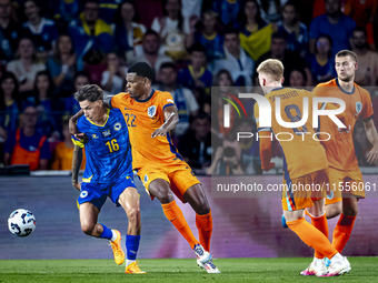 Bosnia and Herzegovina midfielder Denis Huseinbasic and Netherlands defender Denzel Dumfries during the match between the Netherlands and Bo...