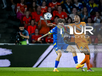 Bosnia and Herzegovina midfielder Denis Huseinbasic and Netherlands defender Denzel Dumfries during the match between the Netherlands and Bo...