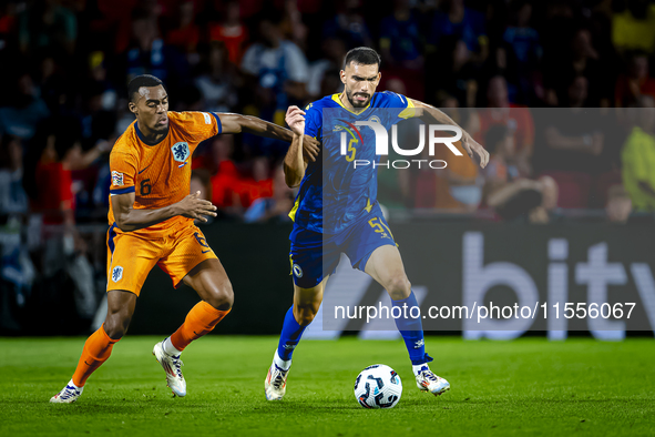 Netherlands midfielder Ryan Gravenberch and Bosnia and Herzegovina defender Adrian Leon Barisic during the match between the Netherlands and...