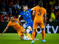 Netherlands midfielder Ryan Gravenberch and Bosnia and Herzegovina defender Adrian Leon Barisic during the match between the Netherlands and...