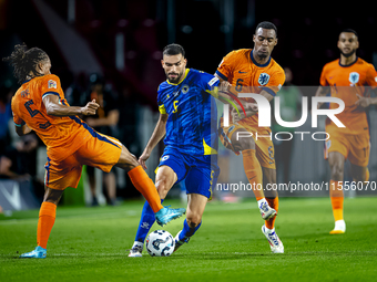 Netherlands midfielder Ryan Gravenberch and Bosnia and Herzegovina defender Adrian Leon Barisic during the match between the Netherlands and...