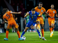 Netherlands midfielder Ryan Gravenberch and Bosnia and Herzegovina defender Adrian Leon Barisic during the match between the Netherlands and...