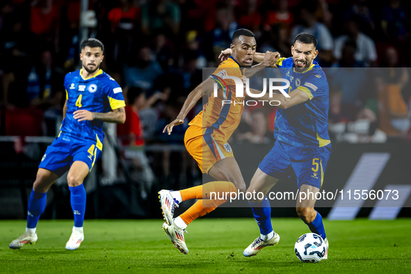 Netherlands midfielder Ryan Gravenberch and Bosnia and Herzegovina defender Adrian Leon Barisic during the match between the Netherlands and...