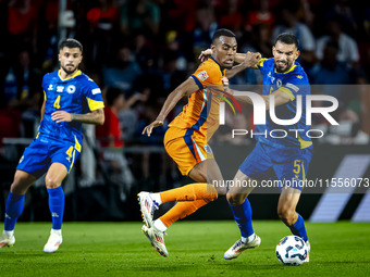 Netherlands midfielder Ryan Gravenberch and Bosnia and Herzegovina defender Adrian Leon Barisic during the match between the Netherlands and...