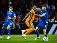 Netherlands midfielder Ryan Gravenberch and Bosnia and Herzegovina defender Adrian Leon Barisic during the match between the Netherlands and...