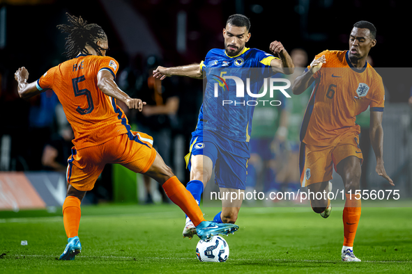 Netherlands midfielder Ryan Gravenberch and Bosnia and Herzegovina defender Adrian Leon Barisic during the match between the Netherlands and...