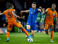 Netherlands midfielder Ryan Gravenberch and Bosnia and Herzegovina defender Adrian Leon Barisic during the match between the Netherlands and...