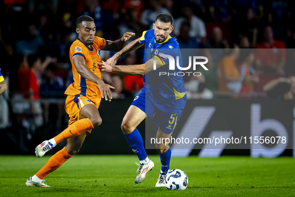 Netherlands midfielder Ryan Gravenberch and Bosnia and Herzegovina defender Adrian Leon Barisic during the match between the Netherlands and...