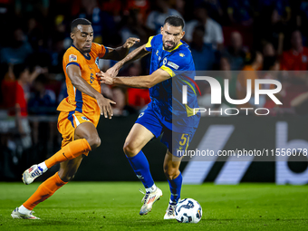 Netherlands midfielder Ryan Gravenberch and Bosnia and Herzegovina defender Adrian Leon Barisic during the match between the Netherlands and...