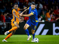 Netherlands midfielder Ryan Gravenberch and Bosnia and Herzegovina defender Adrian Leon Barisic during the match between the Netherlands and...