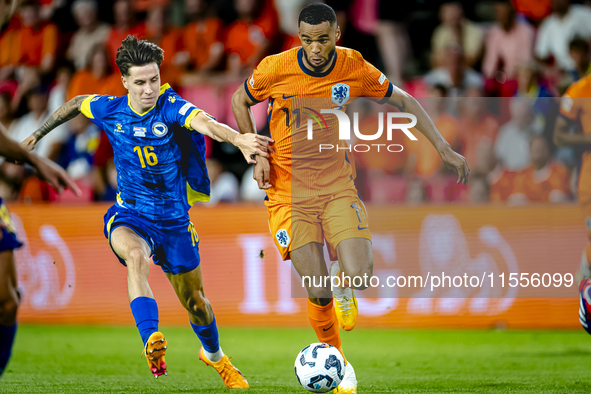 Bosnia and Herzegovina midfielder Denis Huseinbasic and Netherlands forward Cody Gakpo during the match between the Netherlands and Bosnia a...