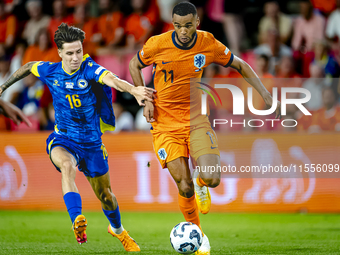 Bosnia and Herzegovina midfielder Denis Huseinbasic and Netherlands forward Cody Gakpo during the match between the Netherlands and Bosnia a...