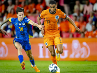 Bosnia and Herzegovina midfielder Denis Huseinbasic and Netherlands forward Cody Gakpo during the match between the Netherlands and Bosnia a...