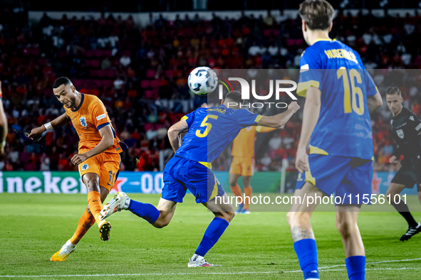 Netherlands forward Cody Gakpo and Bosnia and Herzegovina defender Adrian Leon Barisic during the match between the Netherlands and Bosnia a...