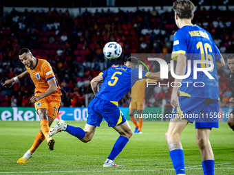 Netherlands forward Cody Gakpo and Bosnia and Herzegovina defender Adrian Leon Barisic during the match between the Netherlands and Bosnia a...