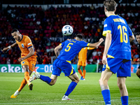 Netherlands forward Cody Gakpo and Bosnia and Herzegovina defender Adrian Leon Barisic during the match between the Netherlands and Bosnia a...