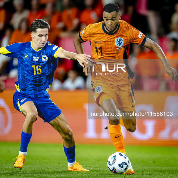 Bosnia and Herzegovina midfielder Denis Huseinbasic and Netherlands forward Cody Gakpo during the match between the Netherlands and Bosnia a...