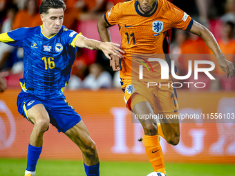 Bosnia and Herzegovina midfielder Denis Huseinbasic and Netherlands forward Cody Gakpo during the match between the Netherlands and Bosnia a...